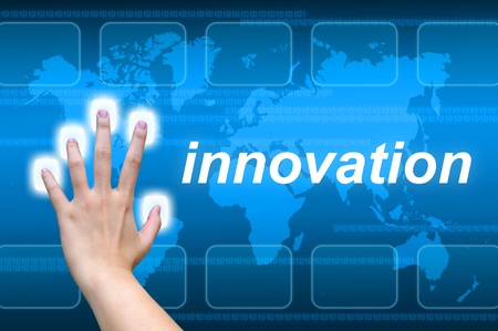 hand pushing innovation button on a touch screen interfaceの写真素材