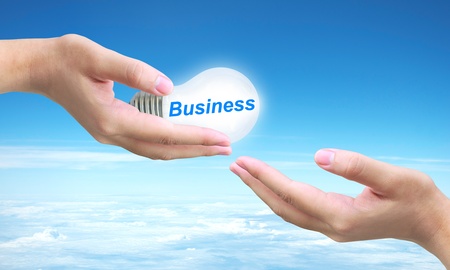 sending business light bulb on women handの写真素材