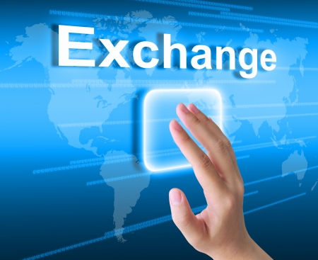 hand pushing exchange button on a touch screen interface の写真素材