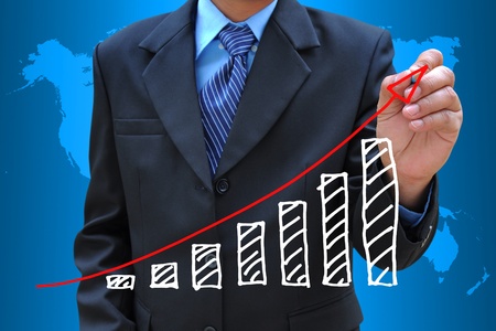 businessman hand drawing business graphの写真素材