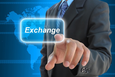 businessman hand pushing exchange button on a touch screen interface の写真素材