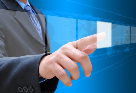 businessman hand pushing button on a touch screen interfaceの写真素材