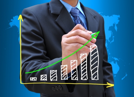 businessman hand drawing business graphの写真素材