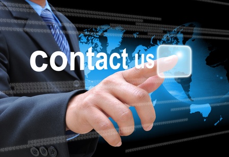 businessman hand pushing contact us button on a touch screen interface の写真素材