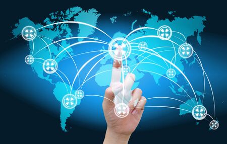 hand pushing social network on world mapの写真素材