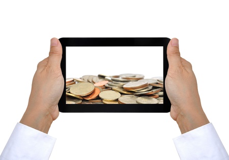 coin and touch pad PC on woman handの写真素材