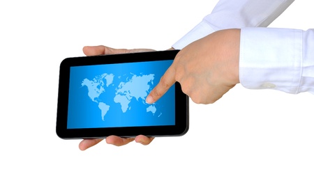 hand pushing a world map on a touch screen interface の写真素材