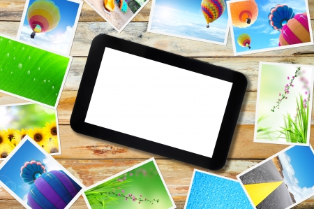 touch pad PC with streaming images on woodの写真素材