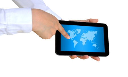 hand pushing a world map on a touch screen interface の写真素材