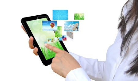touch pad PC and streaming images virtual buttons on women handの写真素材