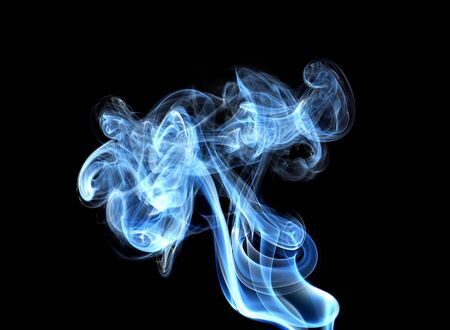 Abstract glowing of smoke isolated on blackの写真素材