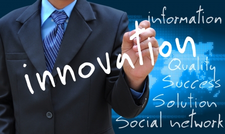 businessman hand writing innovationの写真素材