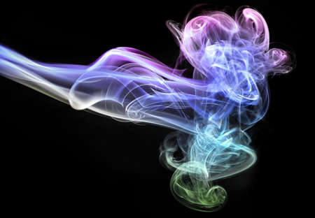 Abstract glowing of smoke isolated on blackの写真素材