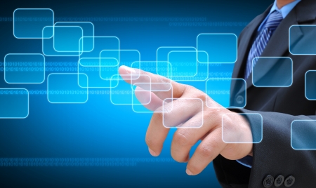 businessman hand pushing button on a touch screen interfaceの写真素材