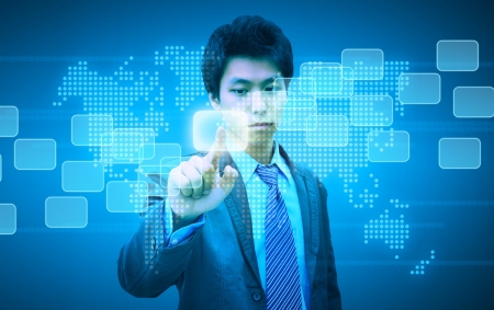 businessman hand pushing button on a touch screen interfaceの写真素材