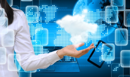 hand holding a cloud on technology backgroundの写真素材