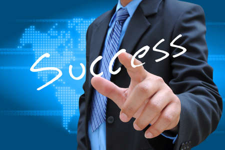 businessman hand pushing success button on a touch screen interface の写真素材