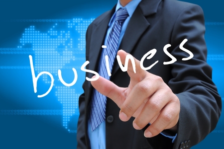 businessman hand pushing business button on a touch screen interface の写真素材