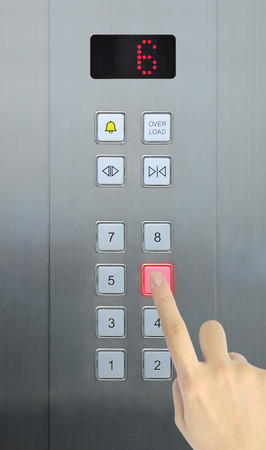 hand press 6 floor in elevatorの写真素材