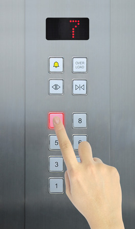 hand press 7 floor in elevatorの写真素材