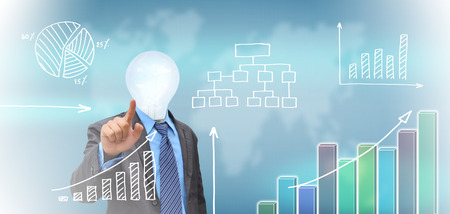 businessman hand pushing a business graph on a touch screen interfaceの写真素材
