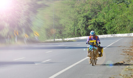 man riding bicycle travelの写真素材