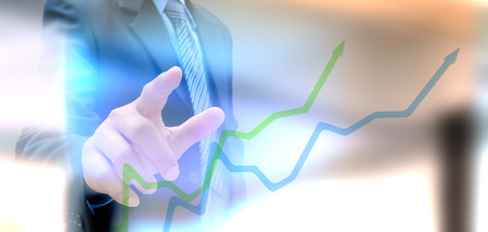 businessman hand writing a business graphの写真素材