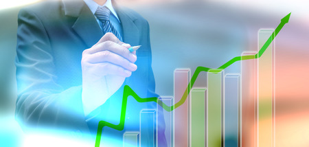 businessman hand writing a business graphの写真素材