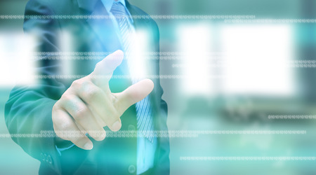 hand pushing social network button on a touch screen interfaceの写真素材
