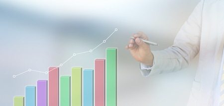 businessman hand writing a business graphの写真素材