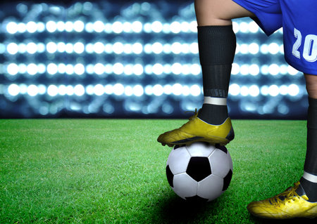 man on soccer field and the bright lightsの写真素材