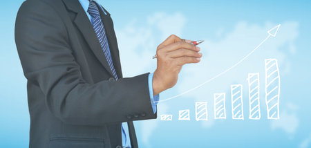 A businessman hand drawing business graphの写真素材