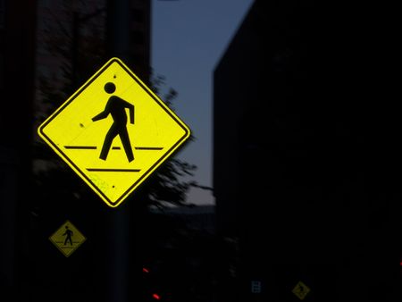 Flash reflection off crosswalk signの写真素材