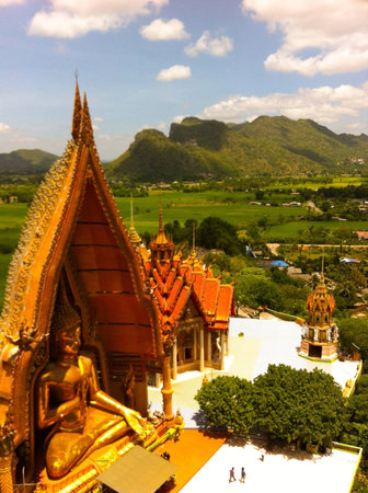 Thai buddhist temple with natural background of rice field in Kanchanaburi, Thailandの素材