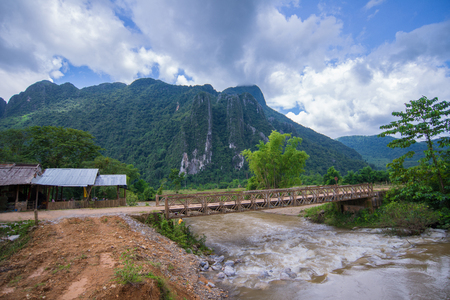 Mountain with river bridge and tree of place to visit lao, Vang Vieng-Laoの写真素材