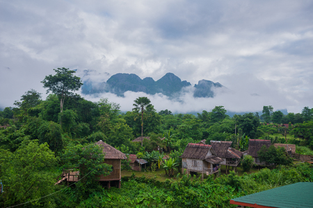 Village with old of nature mountain in Lao VangVieng, VangVieng Laoの写真素材