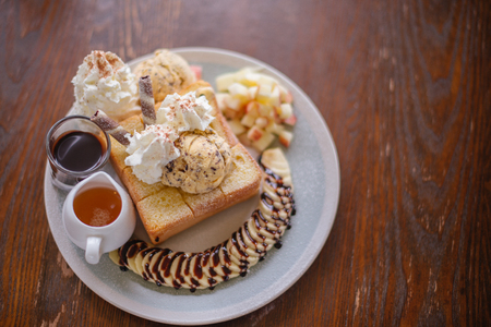dessert with ice cream and apple fruit and bananaの写真素材
