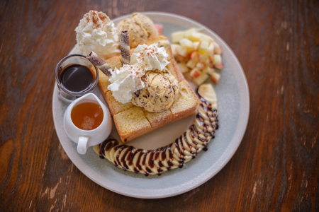 dessert with ice cream and apple fruit and bananaの写真素材