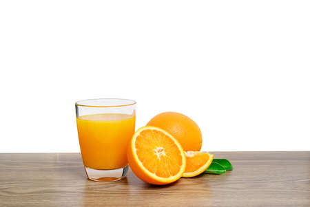 Two fresh orange slices and one orange fruit with green leaf isolated on white background.の写真素材