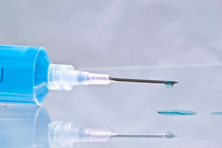 Lit from below, blue medication ready for use.の写真素材