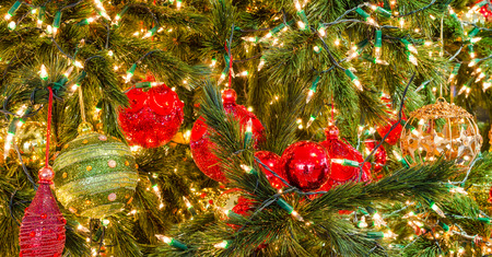 Christmas balls on tree (focus green ball)の写真素材