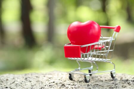 trolley with heart, idea for shopping using as business backgroundの写真素材