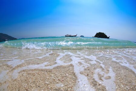 close up image of big wave on beautiful beach. tropical sea in Thailandの写真素材