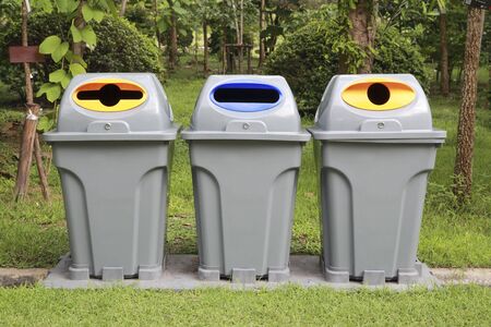 many trash can near the road in the parkの写真素材