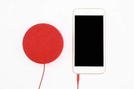 portable speaker with smart phone isolated and white backgroundの写真素材