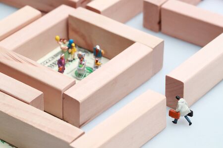 Miniature people: businessman walking and try to reach customer, Financial and Business competition concept using as backgroundの写真素材