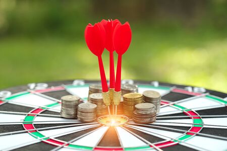 dartboard target center with arrows, idea of financial and business goal, using as backgroundの写真素材