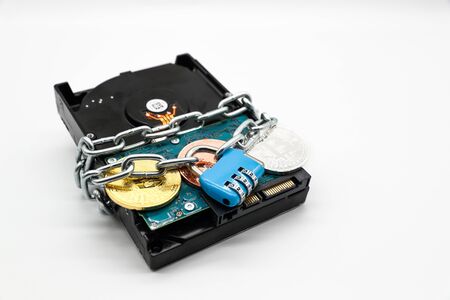 chain locked with password protection on hard disk with money (this image for security technology concept)の写真素材