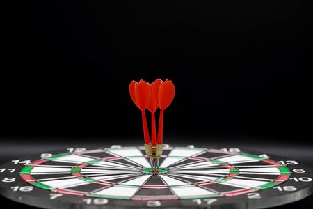 dartboard target center with arrows, idea of financial and business goal, using as backgroundの写真素材