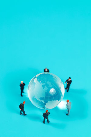 a group of businessman meeting around earth on blue background (creative concept)